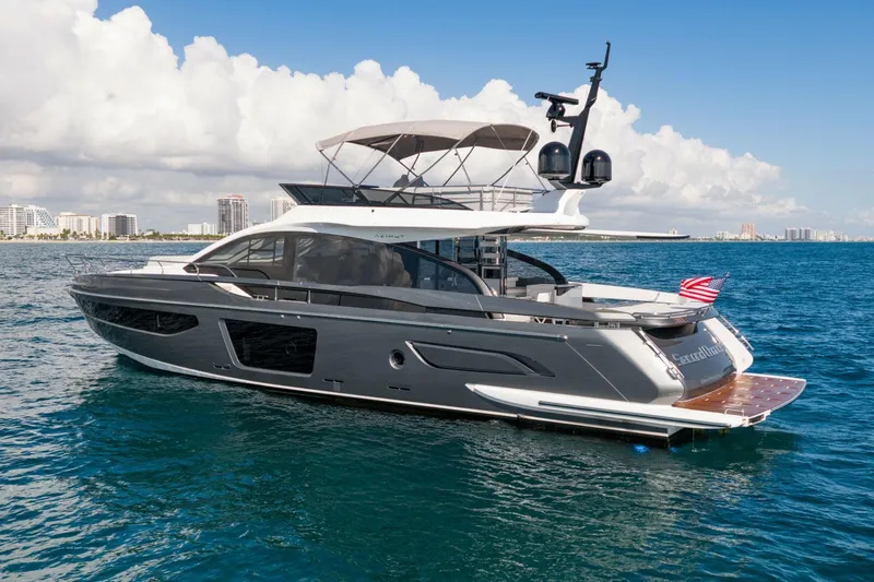 Second Chances Yacht Photos Pics 2024 Azimut S7 yacht cruising on blue ocean waters under a clear sky.