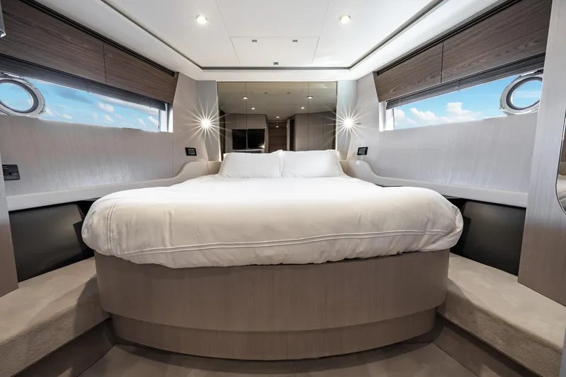 Second Chances Yacht Photos Pics Luxurious bedroom interior of 2024 Azimut S7 yacht with modern design and elegant furnishings.