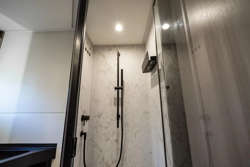 Second Chances Yacht Photos Pics Luxurious 2024 Azimut S7 yacht bathroom with modern shower design and elegant marble walls.