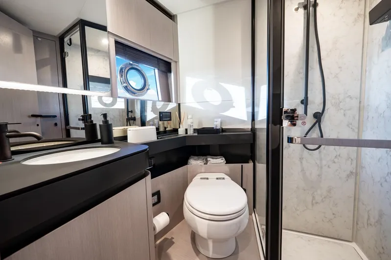 Second Chances Yacht Photos Pics Luxurious bathroom in 2024 Azimut S7 yacht with modern fixtures and elegant design.