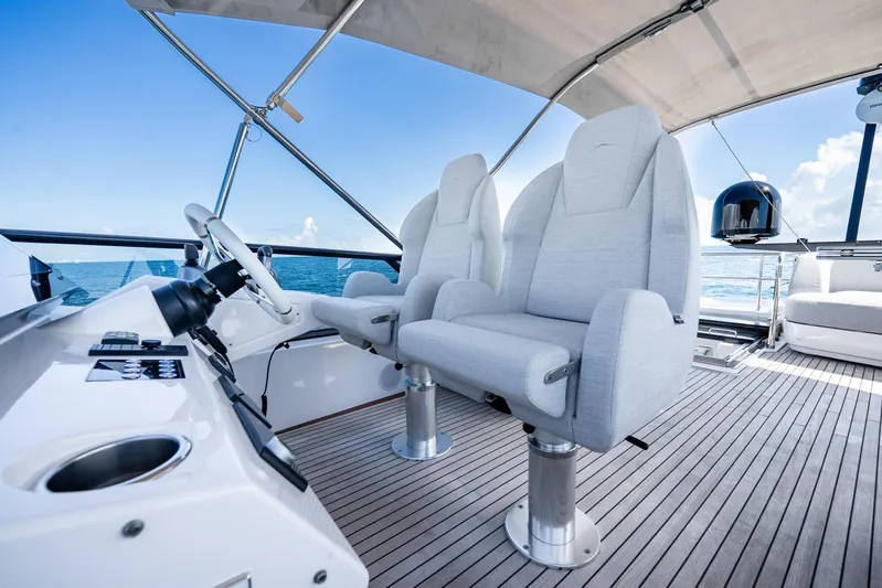 Second Chances Yacht Photos Pics Luxury helm seats on 2024 Azimut S7 yacht, featuring sleek design and ocean view.