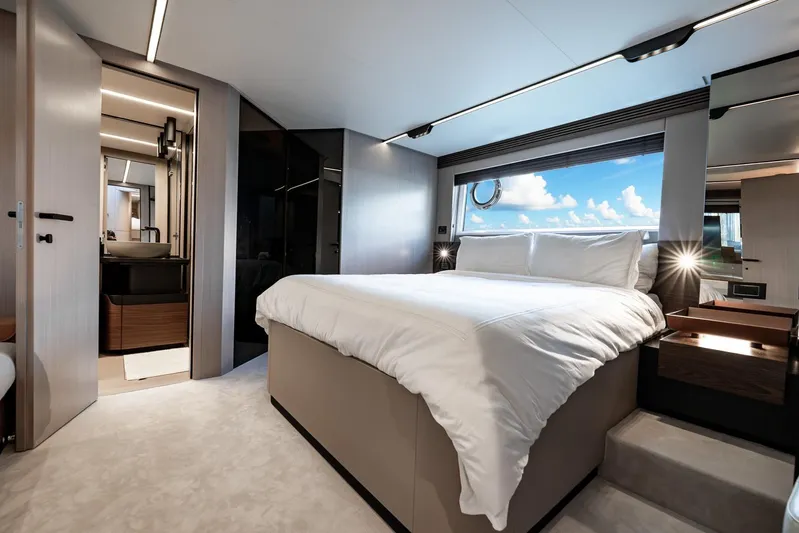 Second Chances Yacht Photos Pics Luxurious bedroom interior of 2024 Azimut S7 yacht with ocean view window.