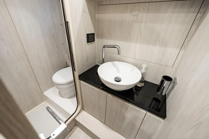 Second Chances Yacht Photos Pics Luxurious bathroom in 2024 Azimut S7 yacht with modern sink and toilet.
