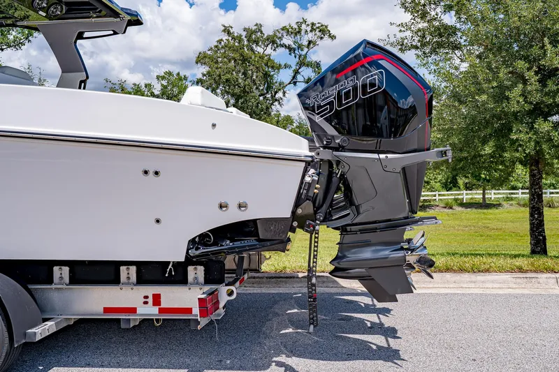  Yacht Photos Pics 2026 Fountain 38 SCX boat with powerful outboard engine on trailer.