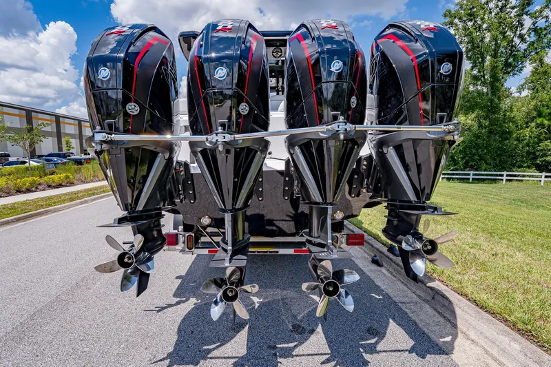  Yacht Photos Pics 2026 Fountain 38 SCX boat with four powerful outboard engines on a sunny day.
