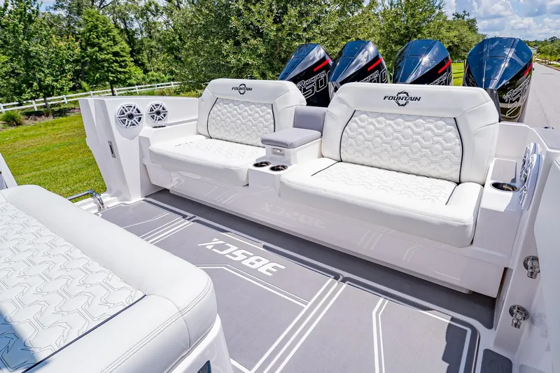  Yacht Photos Pics 2026 Fountain 38 SCX boat interior with luxurious white seating and powerful engines.