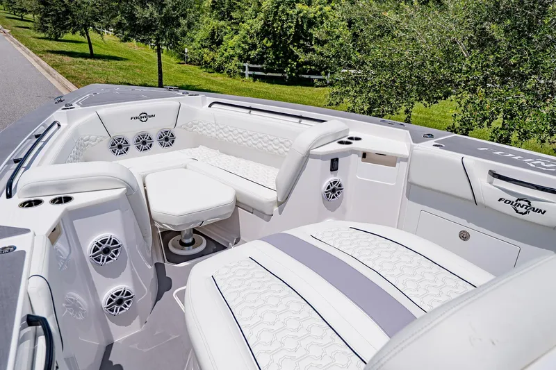  Yacht Photos Pics Luxurious seating area on 2026 Fountain 38 SCX boat, featuring elegant white upholstery.