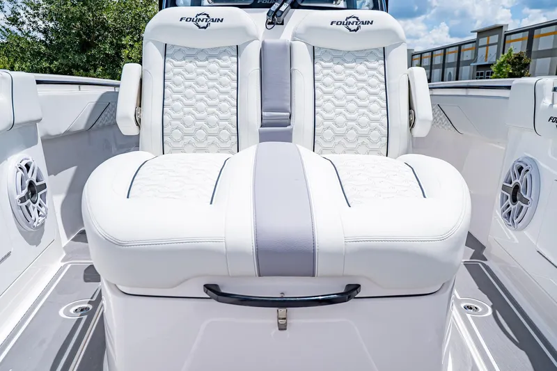  Yacht Photos Pics 2026 Fountain 38 SCX boat interior with luxurious white seating and speaker system.