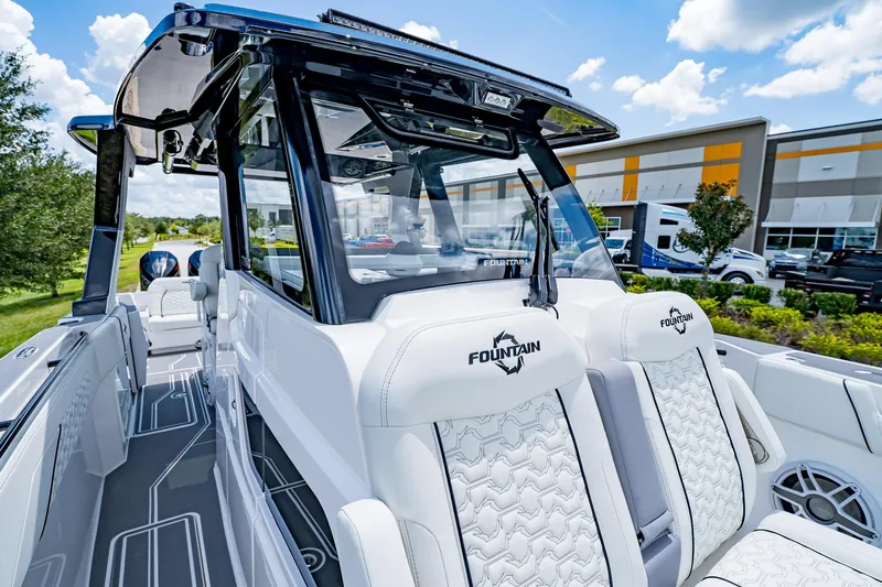  Yacht Photos Pics 2026 Fountain 38 SCX boat interior with sleek design and luxurious seating.