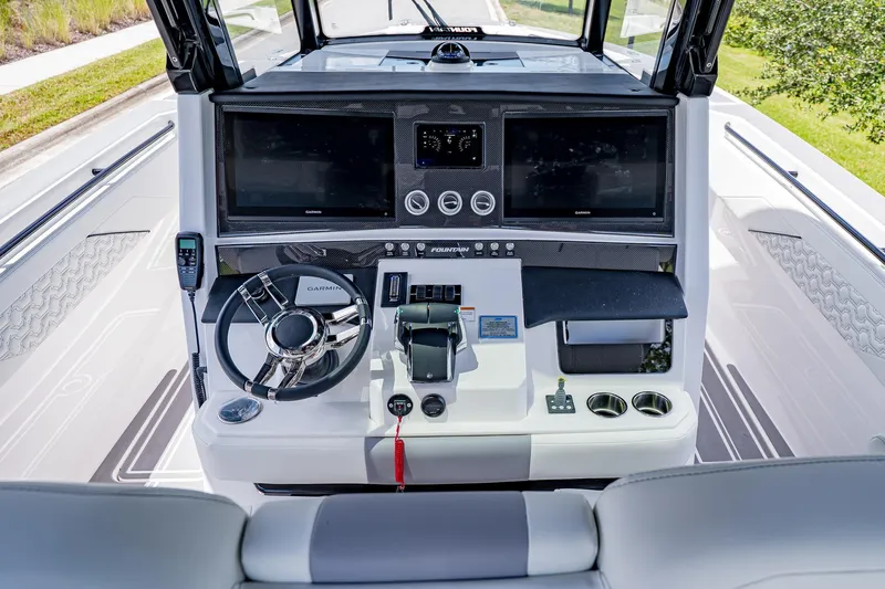  Yacht Photos Pics 2026 Fountain 38 SCX boat dashboard with dual Garmin displays and modern controls.