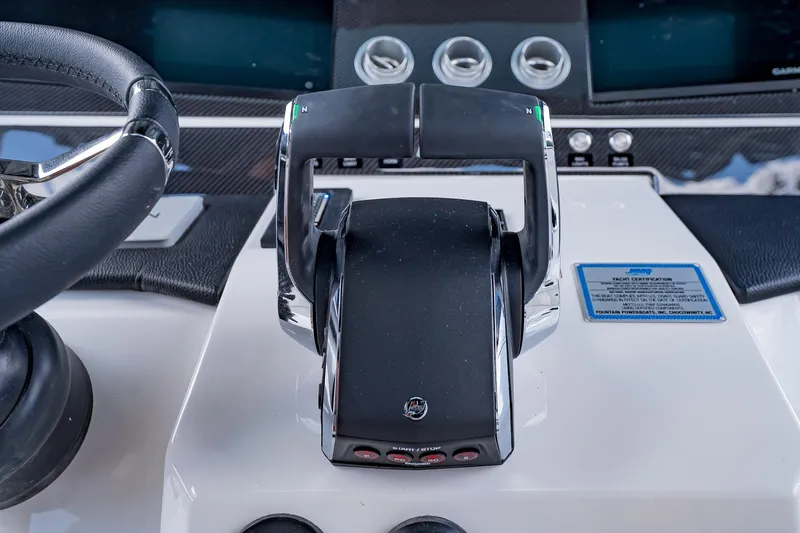  Yacht Photos Pics 2026 Fountain 38 SCX boat throttle controls and steering wheel close-up.