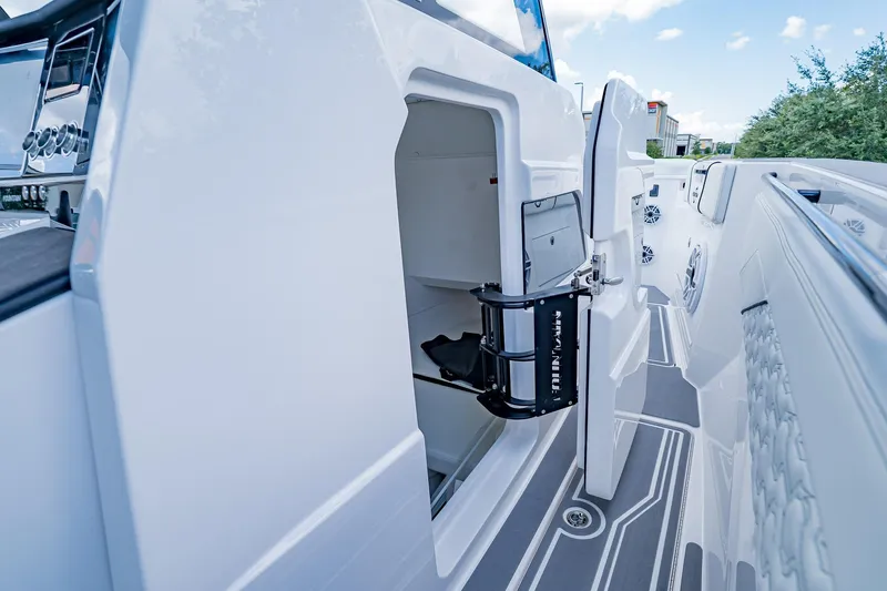  Yacht Photos Pics 2026 Fountain 38 SCX boat interior with open storage compartment and sleek design.