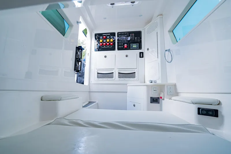  Yacht Photos Pics Interior of 2026 Fountain 38 SCX boat with control panel and seating.