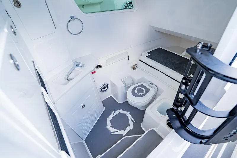  Yacht Photos Pics 2026 Fountain 38 SCX boat interior with modern bathroom amenities and sleek design.