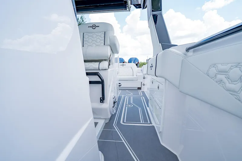  Yacht Photos Pics 2026 Fountain 38 SCX boat interior with sleek white seating and modern design.