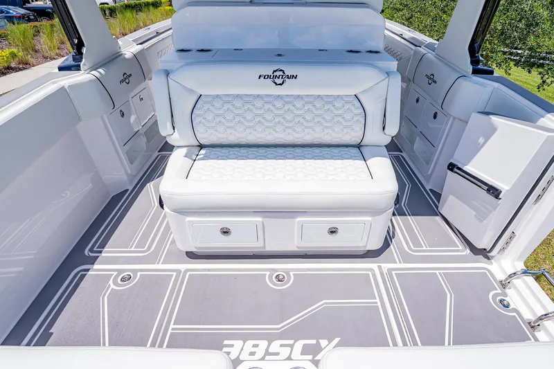  Yacht Photos Pics 2026 Fountain 38 SCX boat interior with white seating and modern flooring design.