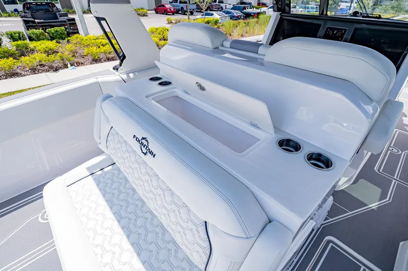  Yacht Photos Pics 2026 Fountain 38 SCX boat interior with white seating and cup holders.