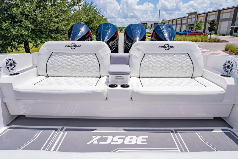  Yacht Photos Pics 2026 Fountain 38 SCX boat interior with luxurious white seating and powerful engines.