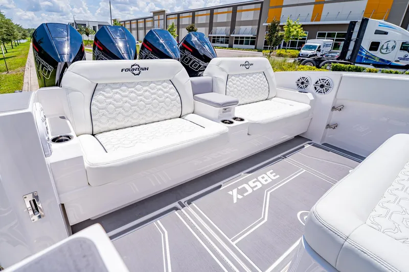  Yacht Photos Pics 2026 Fountain 38 SCX boat interior with luxurious white seating and powerful outboard engines.