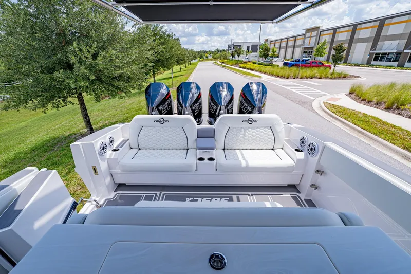  Yacht Photos Pics 2026 Fountain 38 SCX boat with quad engines and luxurious seating on a sunny day.