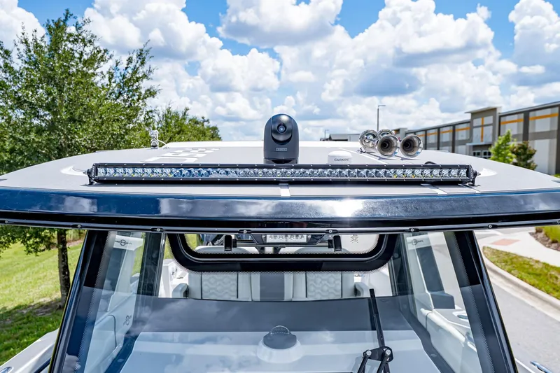  Yacht Photos Pics 2026 Fountain 38 SCX boat with advanced navigation equipment and sleek design.