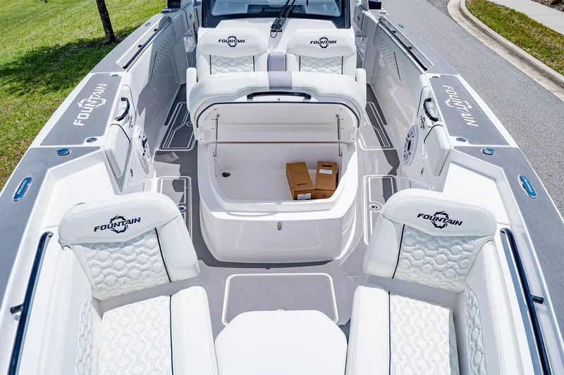  Yacht Photos Pics 2026 Fountain 38 SCX boat interior with white seating and storage compartment.