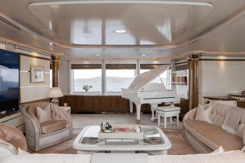 Olympus Yacht Photos Pics Luxurious yacht interior with grand piano, elegant seating, and panoramic windows. Feadship 1996 model.