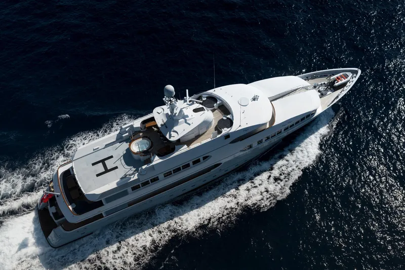 Olympus Yacht Photos Pics Aerial view of 1996 Feadship Full Displacement Motor Yacht cruising on open water.