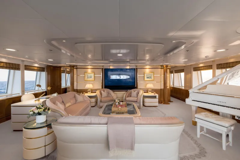 Olympus Yacht Photos Pics Luxurious interior of 1996 Feadship motor yacht with elegant seating and grand piano.