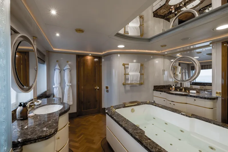 Olympus Yacht Photos Pics Luxurious bathroom on 1996 Feadship motor yacht with marble countertops and jacuzzi tub.