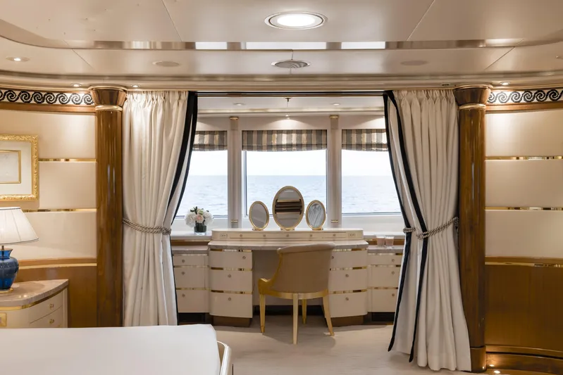 Olympus Yacht Photos Pics Luxurious interior of 1996 Feadship motor yacht with elegant vanity and ocean view.