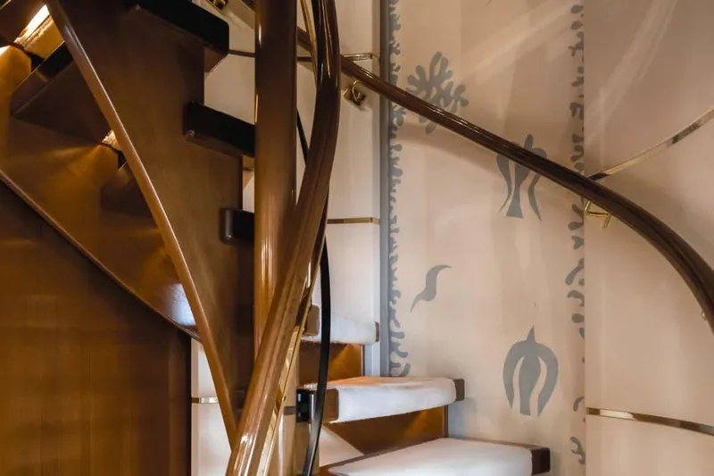Olympus Yacht Photos Pics Luxurious wooden spiral staircase on a 1996 Feadship motor yacht interior.
