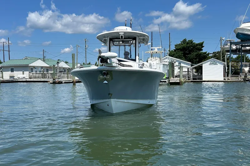 Yacht Photos Pics 2021 Sea Hunt Gamefish 25 boat docked in a marina under a clear blue sky.
