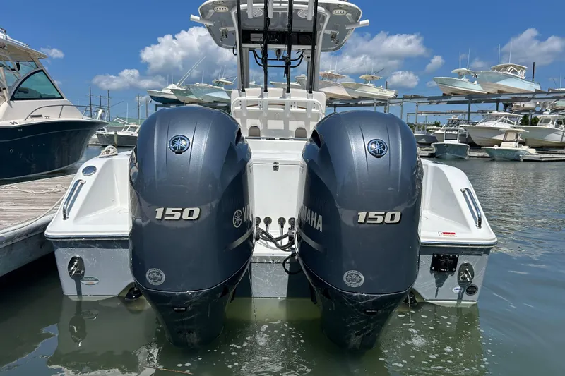  Yacht Photos Pics 2021 Sea Hunt Gamefish 25 with dual Yamaha 150 engines docked at marina.