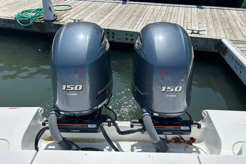  Yacht Photos Pics Twin Yamaha 150 engines on a 2021 Sea Hunt Gamefish 25 boat at dock.