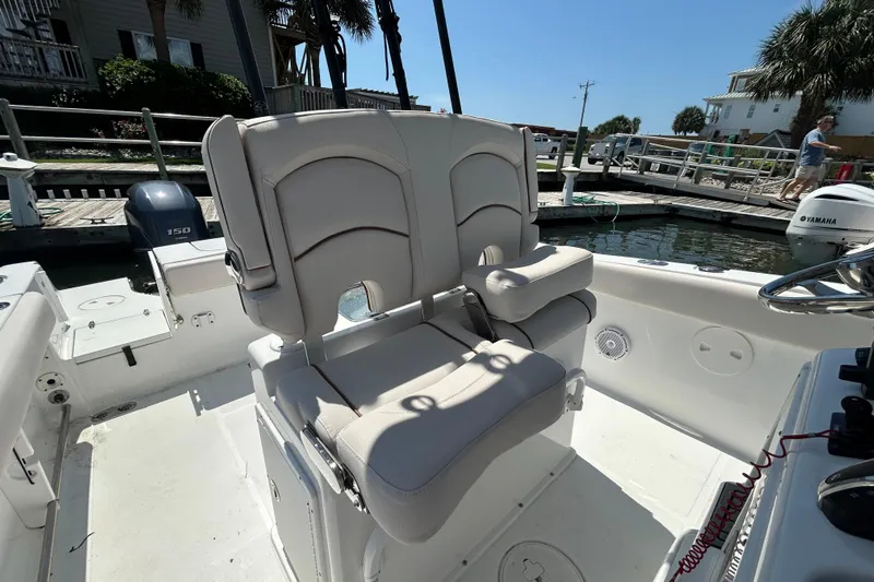  Yacht Photos Pics 2021 Sea Hunt Gamefish 25 boat interior with comfortable seating and Yamaha engine.