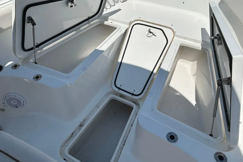  Yacht Photos Pics 2021 Sea Hunt Gamefish 25 boat storage compartments open, showcasing spacious interior.