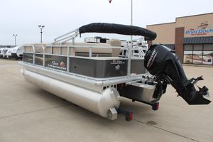 2025 Sun Tracker Party Barge 18 DLX pontoon boat with Mercury outboard motor.