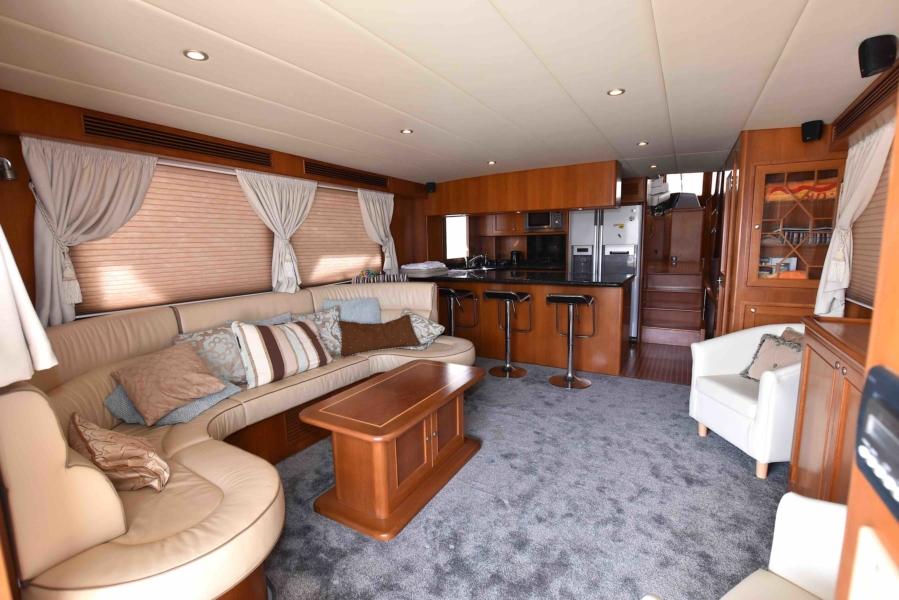 Luxurious interior of 2009 Explorer 64' Trawler Grand Alaskan yacht with elegant furnishings.