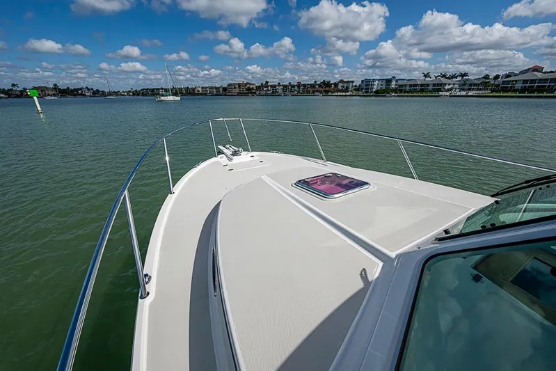 Phoebe Mcbean Yacht Photos Pics 2011 Back Cove 30 boat on calm water under a partly cloudy sky.