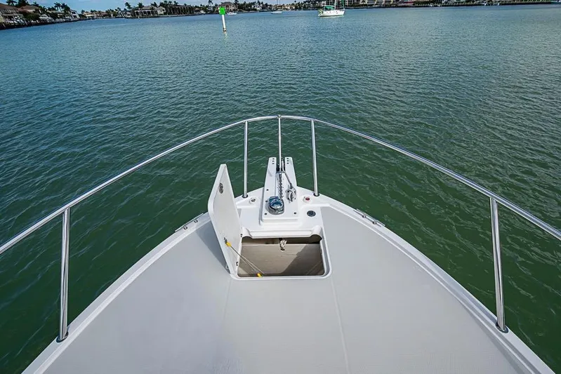 Phoebe Mcbean Yacht Photos Pics Bow view of 2011 Back Cove 30 boat on calm water.