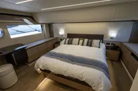 Luxurious bedroom interior of 2021 Absolute 52 Navetta yacht, featuring elegant design and modern amenities.
