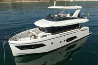 Luxury Absolute 52 Navetta yacht, 2021 model, cruising on calm waters.