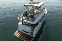 Luxury Absolute 52 Navetta yacht, 2021 model, cruising on calm waters.