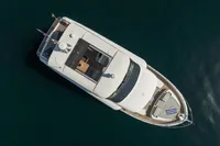 Aerial view of 2021 Absolute 52 Navetta yacht on calm water.