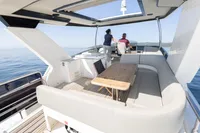 Luxurious 2021 Absolute 52 Navetta yacht with spacious deck and seating area.