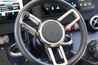 Steering wheel of 2021 Absolute 52 Navetta yacht, featuring modern design and controls.