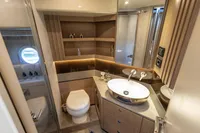 Luxurious bathroom on 2021 Absolute 52 Navetta yacht with modern fixtures and elegant design.