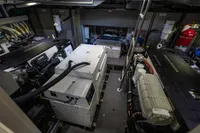 Engine room of 2021 Absolute 52 Navetta yacht, featuring Volvo Penta engines and advanced equipment.