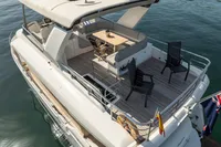Luxurious 2021 Absolute 52 Navetta yacht with spacious deck and seating area.